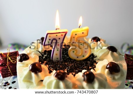 An Image of a birthday cake with candle - 75