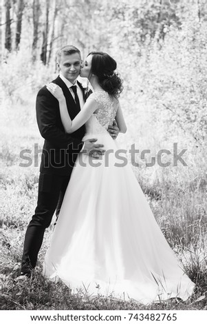 Wedding couple in the summer forest