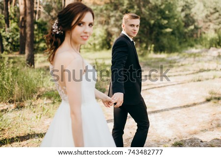 Wedding couple in the summer forest