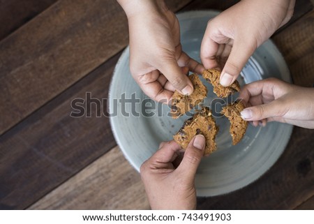 sharing concept - family sharing cookies Royalty-Free Stock Photo #743491903