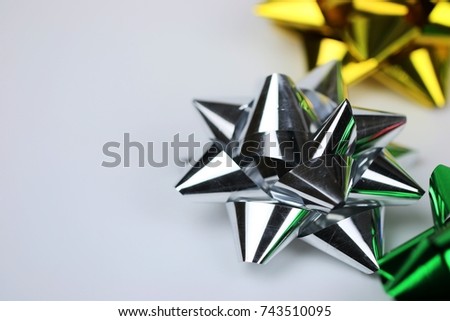 Silver ribbon bow on copy space composition for gift festival concept