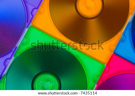 Computer disks in multiciolored boxes, technology background