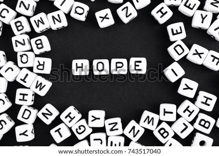 Black and white horizontal composition. Word Hope made of plastic cube.  A series of minimalism phrases and words. 