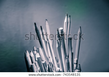 Plastic bottle with pencils and other material photograph