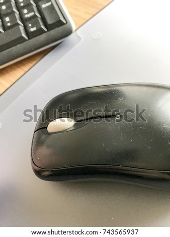 Black mouse and keyboard on desk