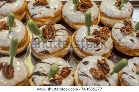 Close up of fresh donuts on bakery display for Hanukkah  celebration. Selective focus.