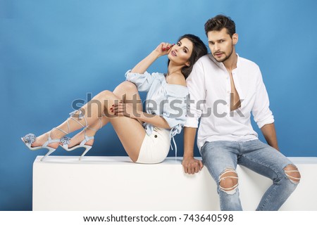 Fashionable picture of young people over blue background