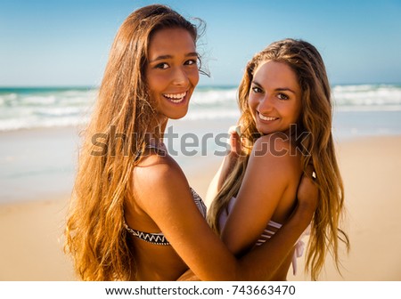 Best friends having fun on the beach 