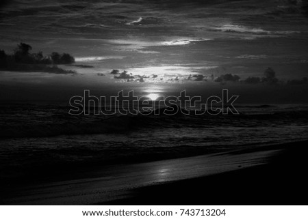 tropical sunset at the Indian ocean - black and white - dark tones, high contrast