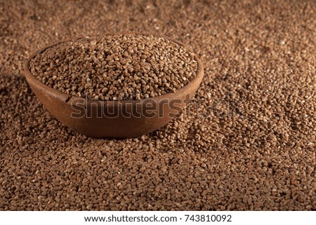 Background in the form of grains of buckwheat with a plate
