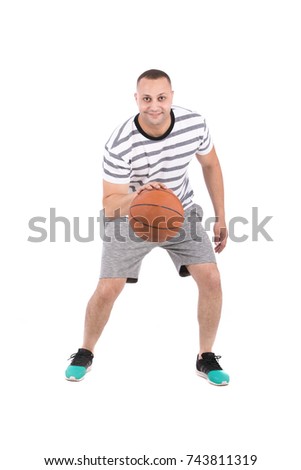 Full-length photo of a basketball player enjoying the game. Isolated on white background.