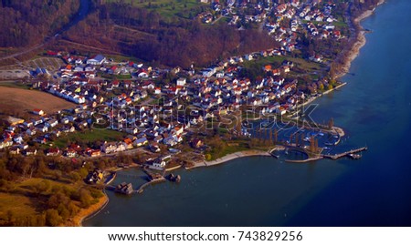 Aerial view of Stilt Houses Museum (Pfahlbaumuseum) and the town Uhldingen, Lake Constance, South  Germany in spring
