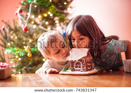 Kids with gingerbread house