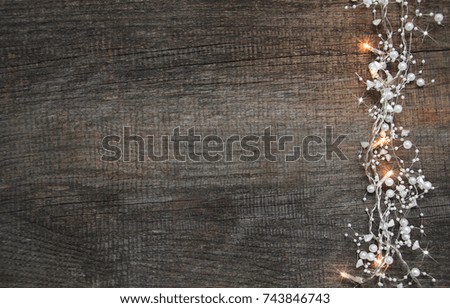 Christmas holiday background - garland  on a wooden table