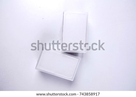 Two boxes of calling cards isolated on white.
