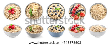 Bowls of oatmeal with berries and fruits on white background Royalty-Free Stock Photo #743878603