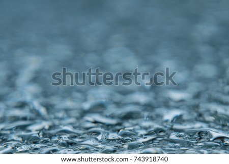 Water drops on mirror background. Selective focus.