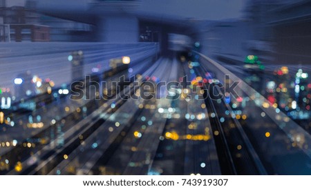 Double espouse moving train motion and blurred bokeh light city downtown, abstract background