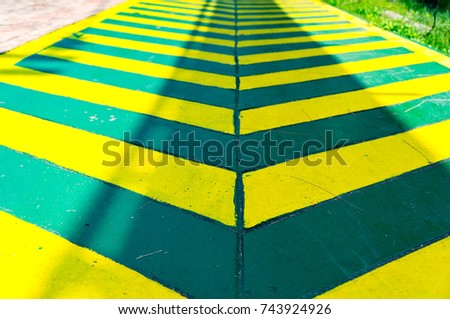 green Cycle lane with yellow line