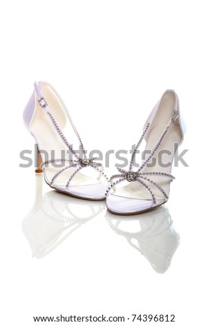 Elegant wedding shoes over white background Royalty-Free Stock Photo #74396812