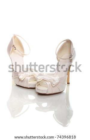 Elegant wedding shoes over white background Royalty-Free Stock Photo #74396818