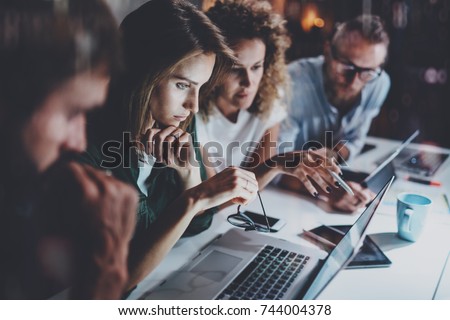 Project team working together at meeting room at office.Brainstorming process concept.Horizontal.Blurred background. Royalty-Free Stock Photo #744004378