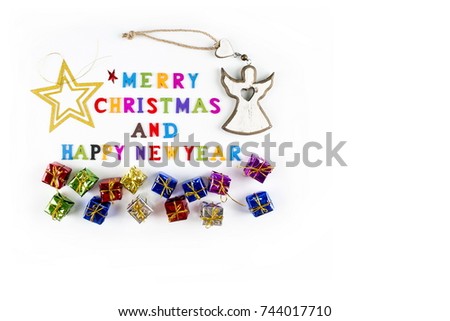 "Merry Christmas and Happy New Year" written with small, colorful, wooden letters and tiny gifts on the pure white background