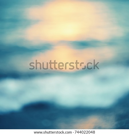 Golden sunlights on blue water background.Abstract background.