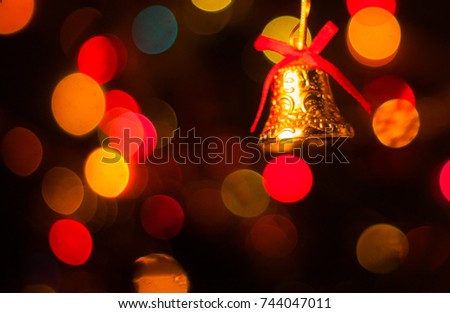A bell for Christmas decoration, colorful bokeh as the background