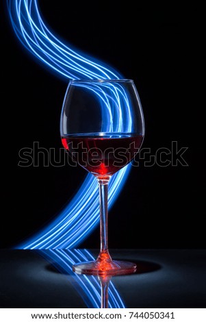 Glass of wine and light effect 