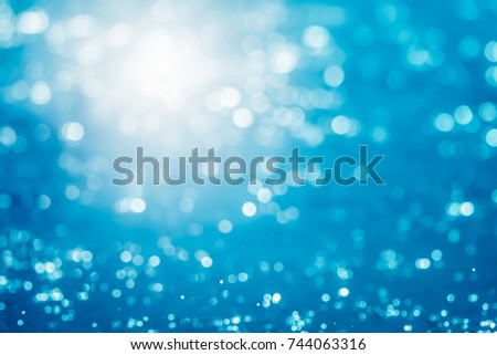 Abstract water bokeh background. Blue Bokeh light  Royalty-Free Stock Photo #744063316