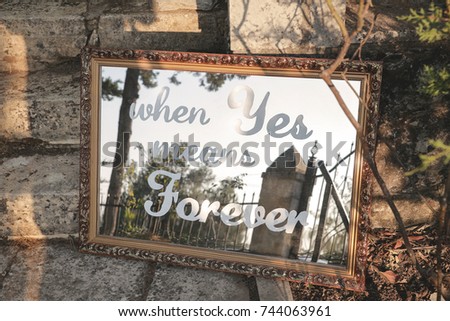Handwritten wedding quote on a mirror