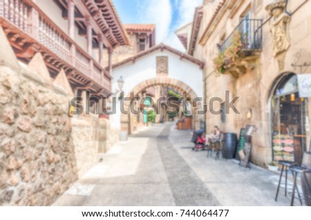 Defocused background of Poble Espanyol, an open-air architectural museum on the Montjuic hill in Barcelona, Catalonia, Spain. Intentionally blurred post production for bokeh effect