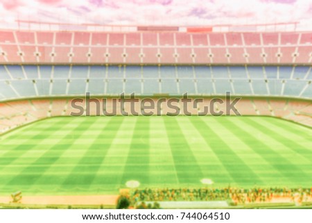 Defocused background with an empty european football stadium. Intentionally blurred post production for bokeh effect