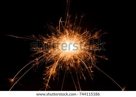 Sparkles isolated on black background.Abstract gold light on the night time.Celebration concept.