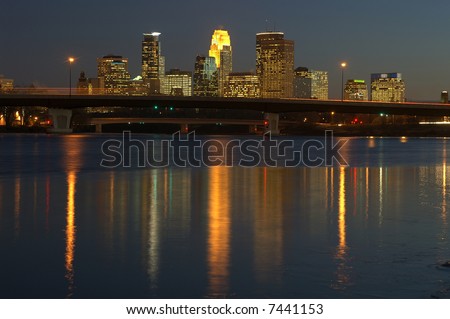 Minneapolis skyline at dusk reflected in the Mississippi River