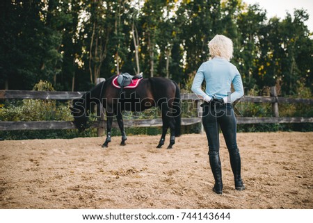 Female rider trains her horse, horseback riding