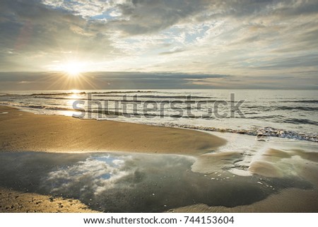 France, Camargue, sunset seen from the beach. Royalty-Free Stock Photo #744153604