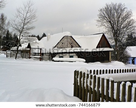Traditional wooden timbered cottage in winter. Folk museum in Vesely Kopec, Czech Republic