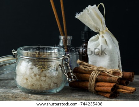 Spa beauty cosmetics and accessories with cinnamon sticks, oil and olive soap
