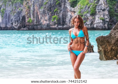 Beautiful woman in bikini on beach at Maya bay, Thailand