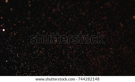 Realistic Glitter Exploding on Black Background. The perfect for visual effects, compositing, and motion graphics. Use blending mode screen .