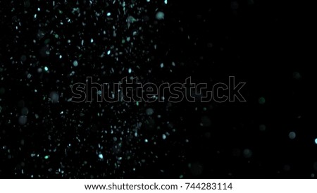 Realistic Glitter Exploding on Black Background. The perfect for visual effects, compositing, and motion graphics. Use blending mode screen .