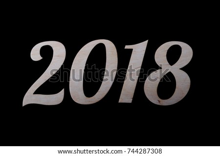 The inscription 2018 is isolated on a black background. New Year's background for your calendar.