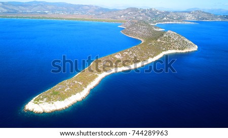 Aerial drone photo from famous Kinosoura peninsula, natural Park and wetland of Schinias with rare Pine trees and turquoise clear waters, Marathon, Attica, Greece