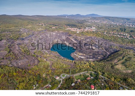 Aerial view, deep mine lake in place of a mining pit