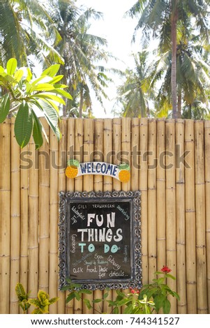 Welcome board in tropical resort