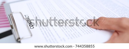 Male arm in suit offer contract form on clipboard pad and silver pen to sign closeup. Strike a bargain for profit white collar motivation union decision corporate sale insurance agent concept