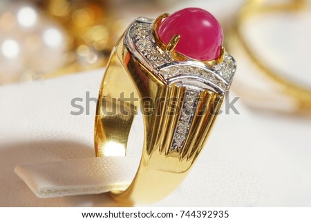 High Value Gems Stone accessories, Gold, Diamond, Ruby ring on holder. Studio lighting bokeh background, HDR stacking macro photo