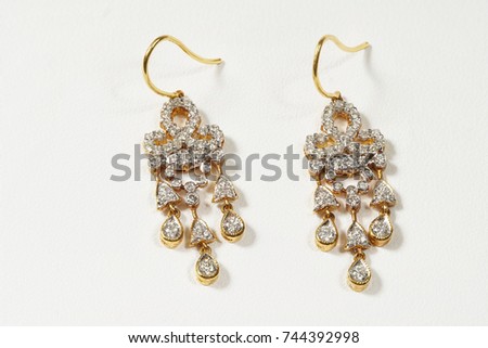 High Value Gems Stone accessories, Gold, Diamond,  earrings pair. Studio lighting white background, HDR stacking macro photo
